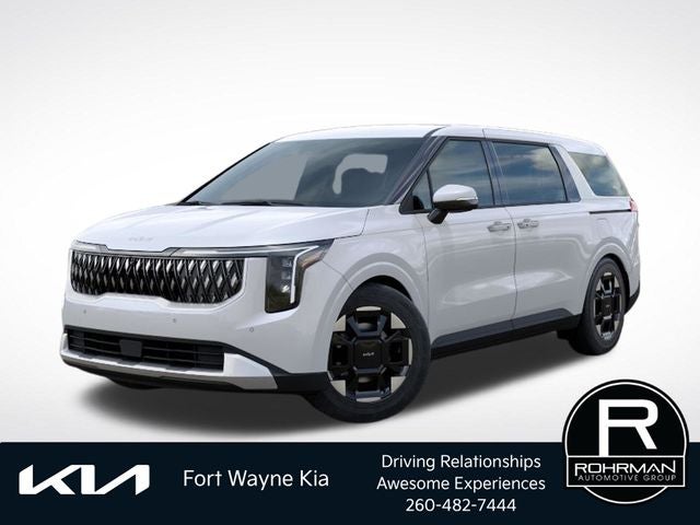 2026 Kia Carnival EX in Snow White Pearl — front three-quarter view