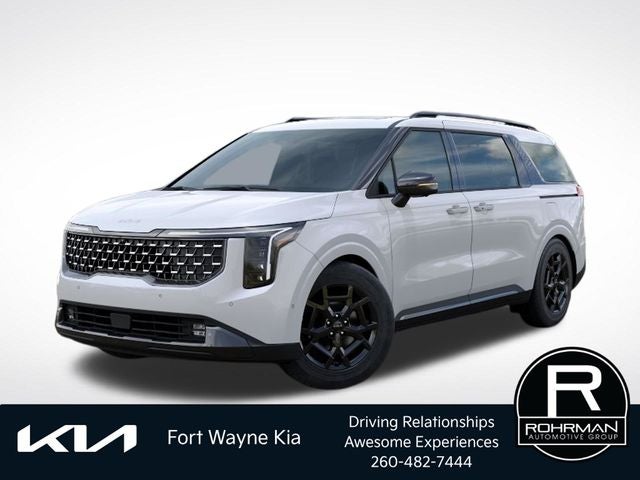 2026 Kia Carnival SX Prestige in Snow White Pearl — front three-quarter view